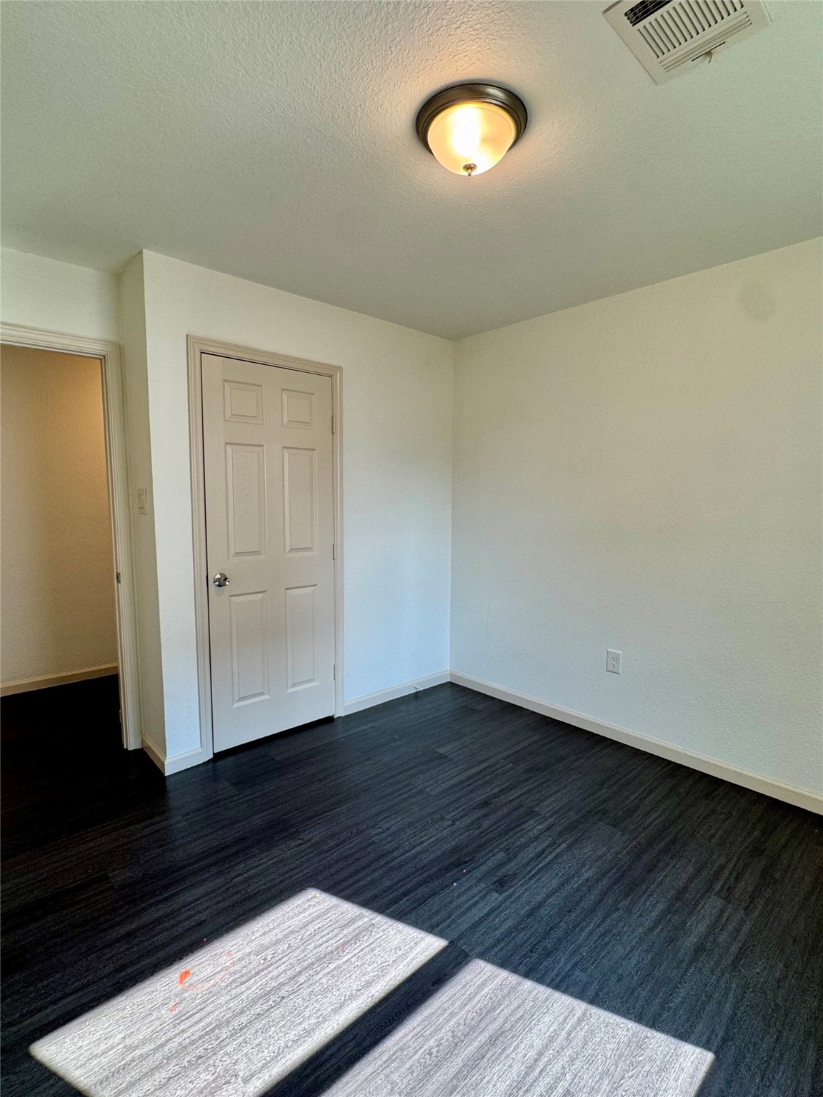 624 Luke Street, Unit A Dayton, TX 77535 - Photo 12 of 20 an empty room with wooden floor