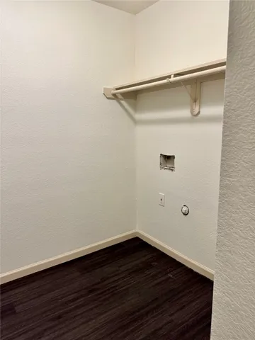 a bathroom with a granite countertop toilet a sink and a mirror