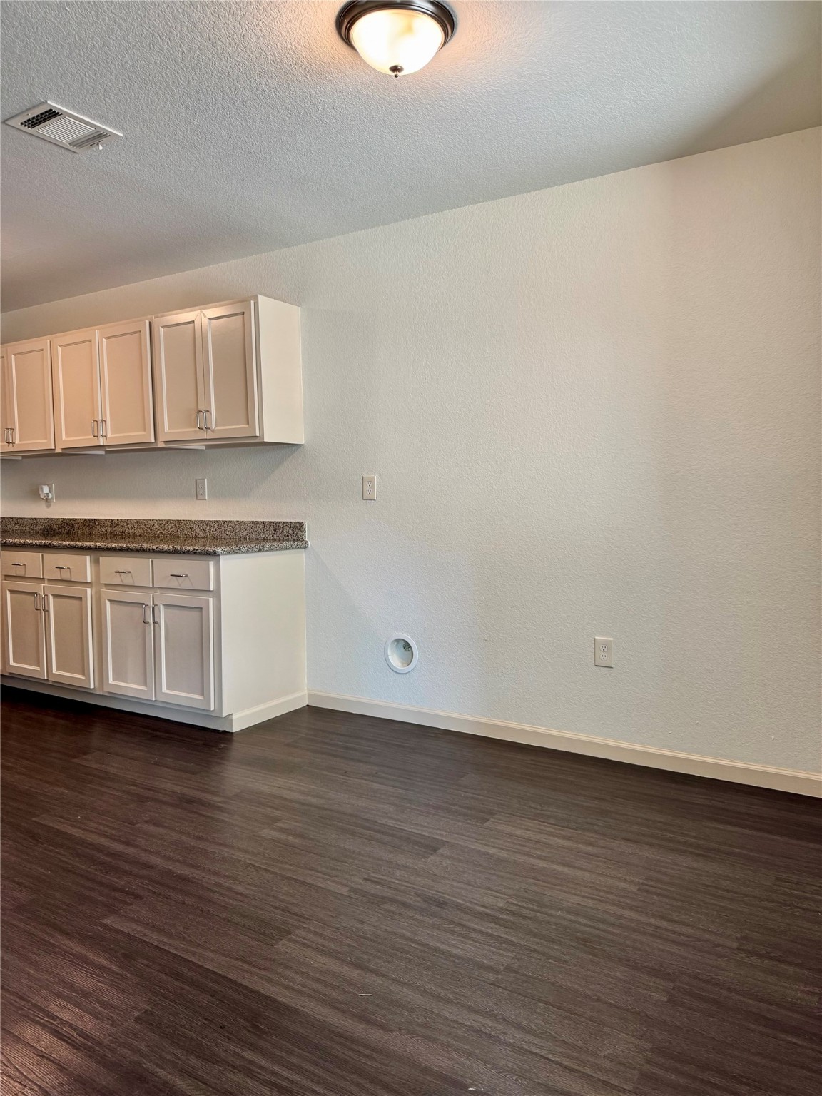 624 Luke Street, Unit A Dayton, TX 77535 - Photo 7 of 20 a view of a kitchen with wooden floor and a sink