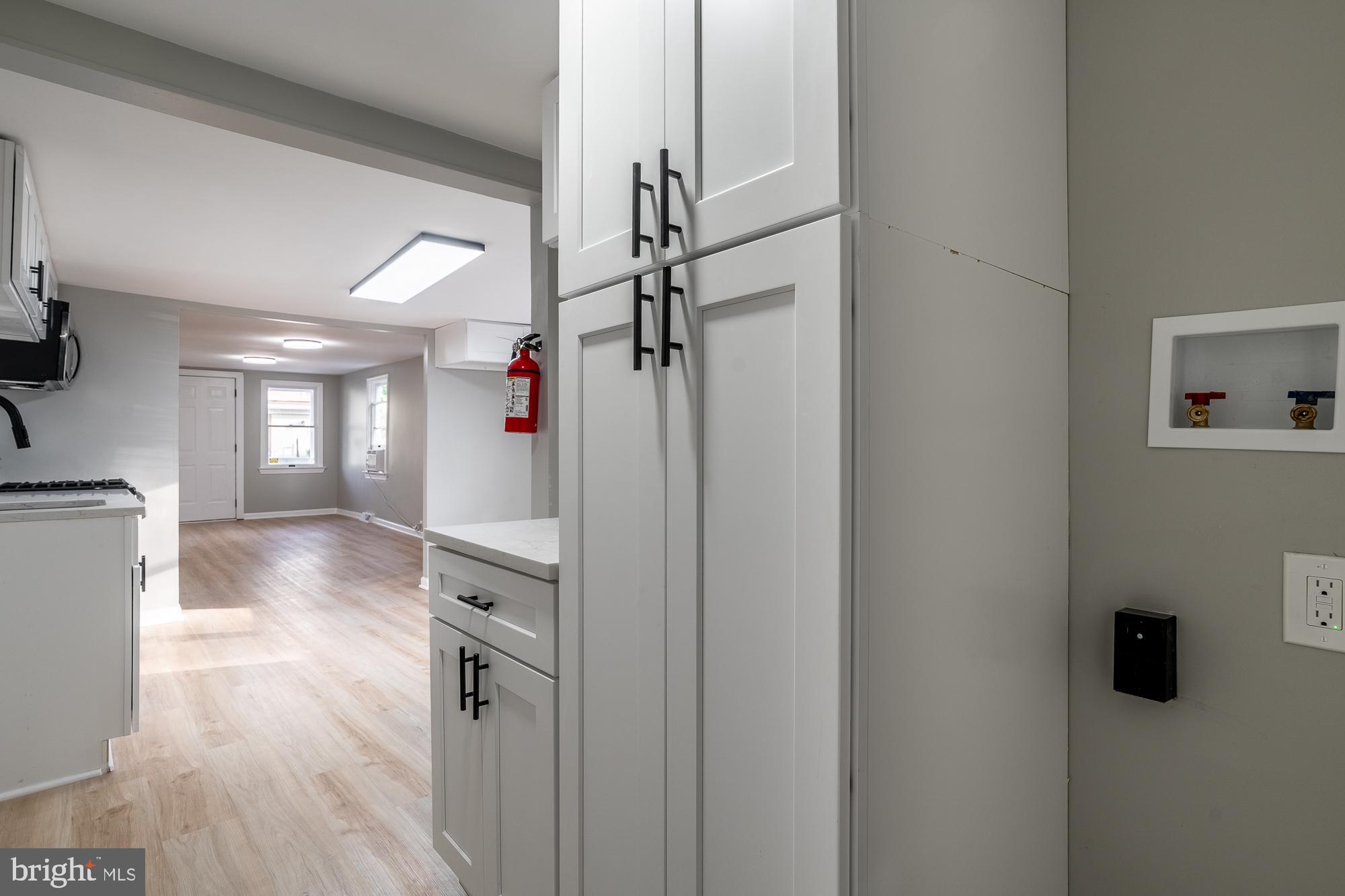 127 West Holly Avenue Pitman, NJ 08071 - Photo 14 of 23 a view of a hallway view with wooden floor and staircase