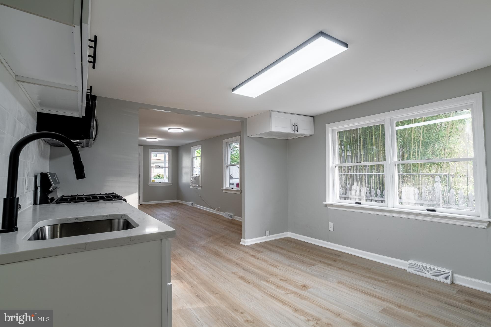 127 West Holly Avenue Pitman, NJ 08071 - Photo 15 of 23 a kitchen with a stove a sink and a window