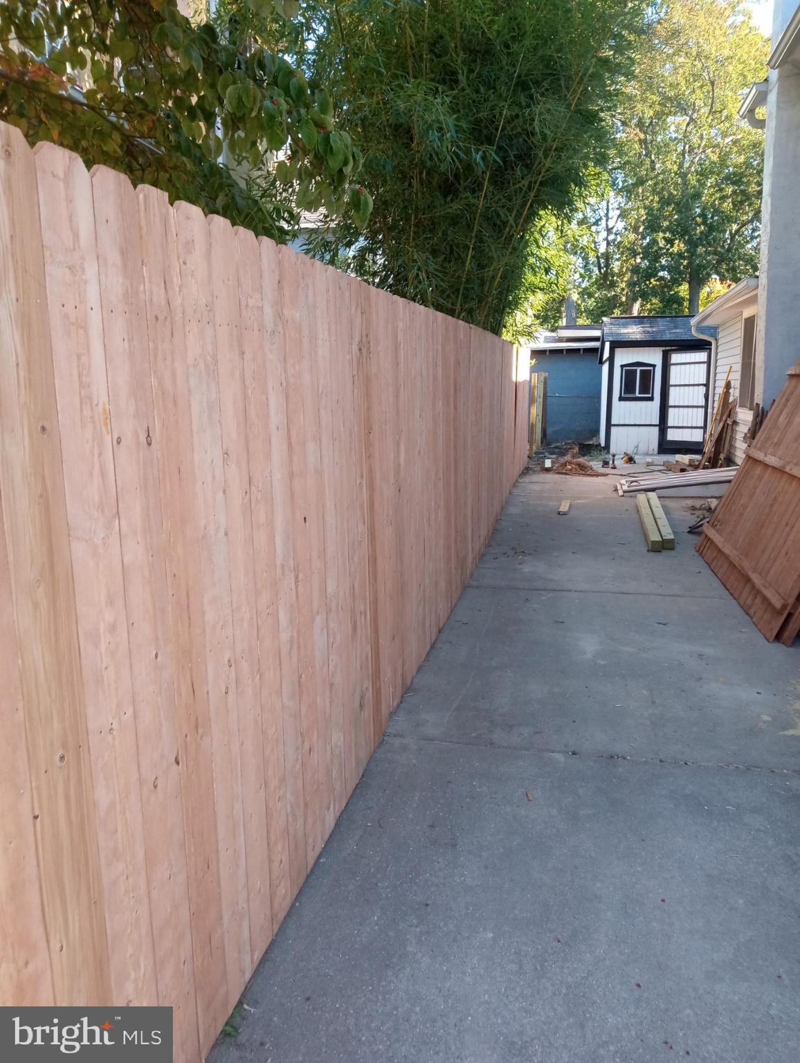 127 West Holly Avenue Pitman, NJ 08071 - Photo 5 of 23 a view of a house with a backyard and a tree