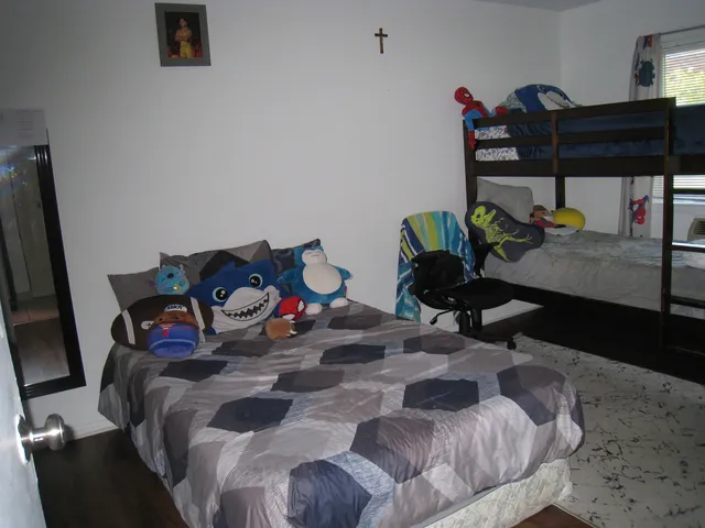 a bedroom with a bed and closet