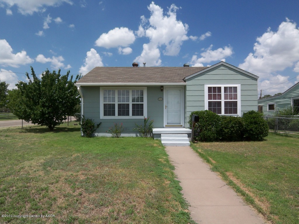 1614 Southwest 48th Avenue Amarillo, TX 79110 - Photo 1 of 13 a view of a house with a back yard