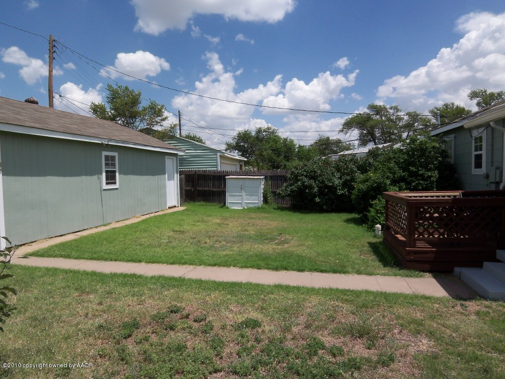 1614 Southwest 48th Avenue Amarillo, TX 79110 - Photo 13 of 13 a view of a backyard with plants and a garden