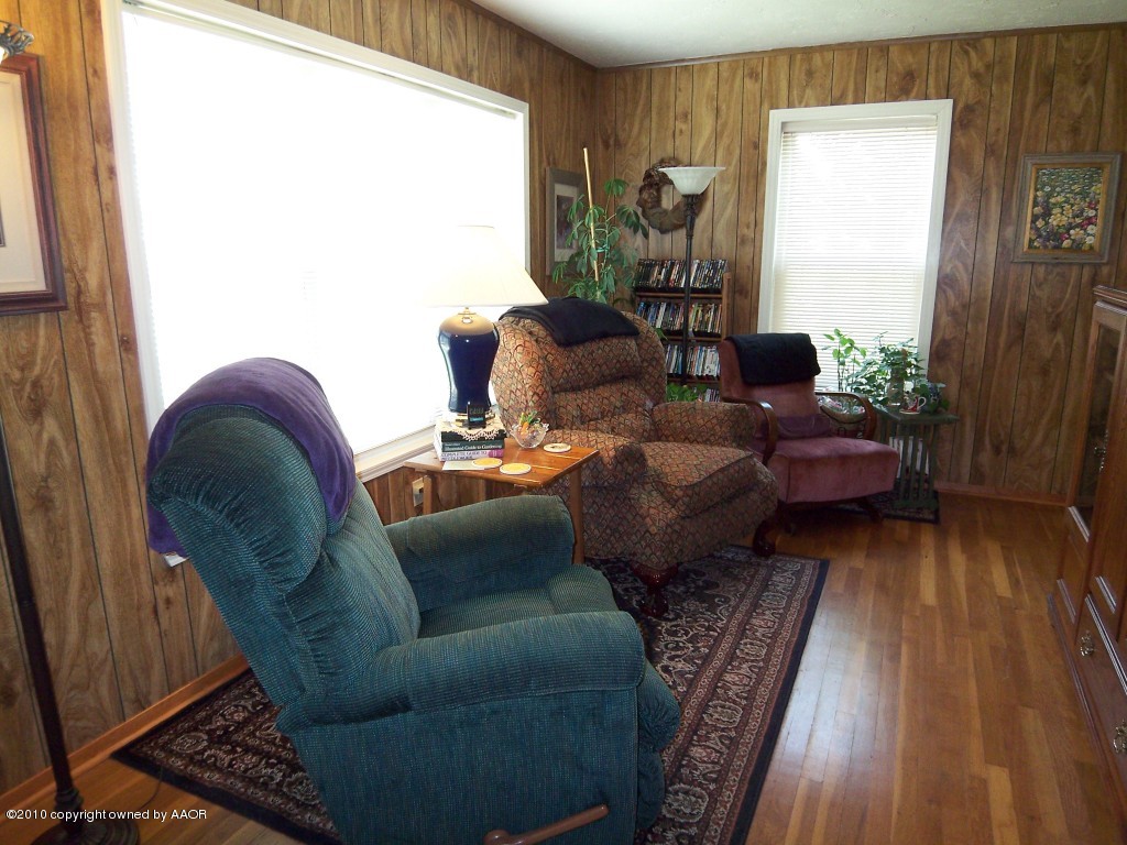 1614 Southwest 48th Avenue Amarillo, TX 79110 - Photo 2 of 13 a living room with furniture and a window