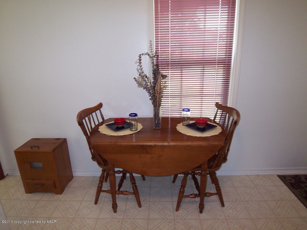1614 Southwest 48th Avenue Amarillo, TX 79110 - Photo 5 of 13 a view of a dining room with furniture and window