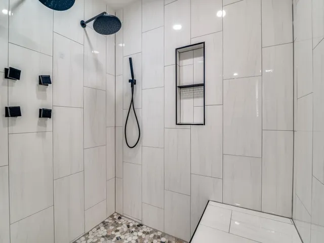 a bathroom with a granite countertop and a sink
