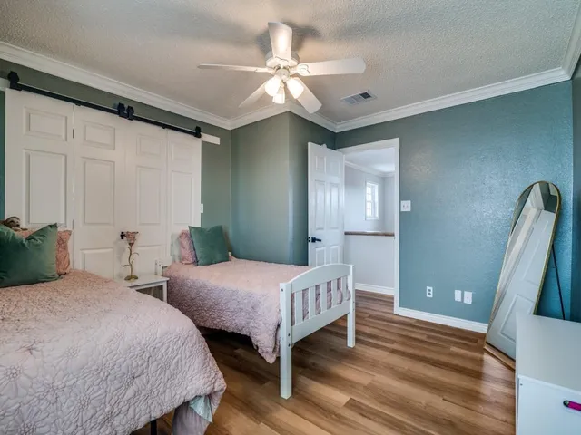 a bedroom with a bed and a table