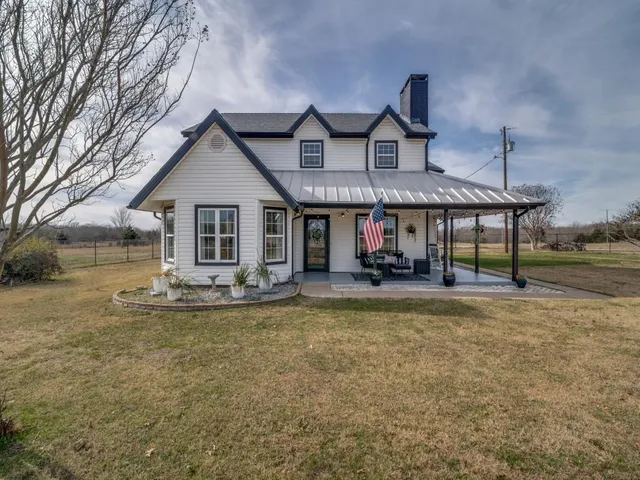 a front view of house with outdoor seating