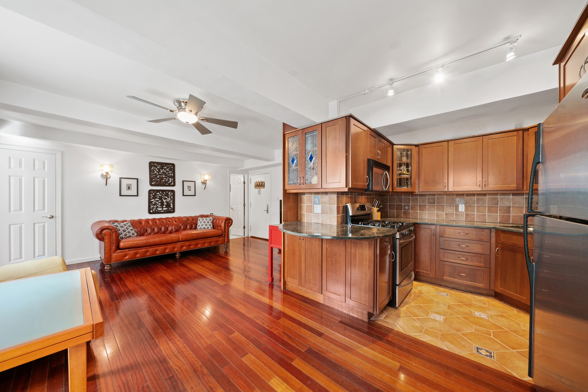 111 Hicks Street, Unit 5QR Brooklyn, NY 11201 - Photo 6 of 19 a living room with stainless steel appliances furniture and a wooden floor