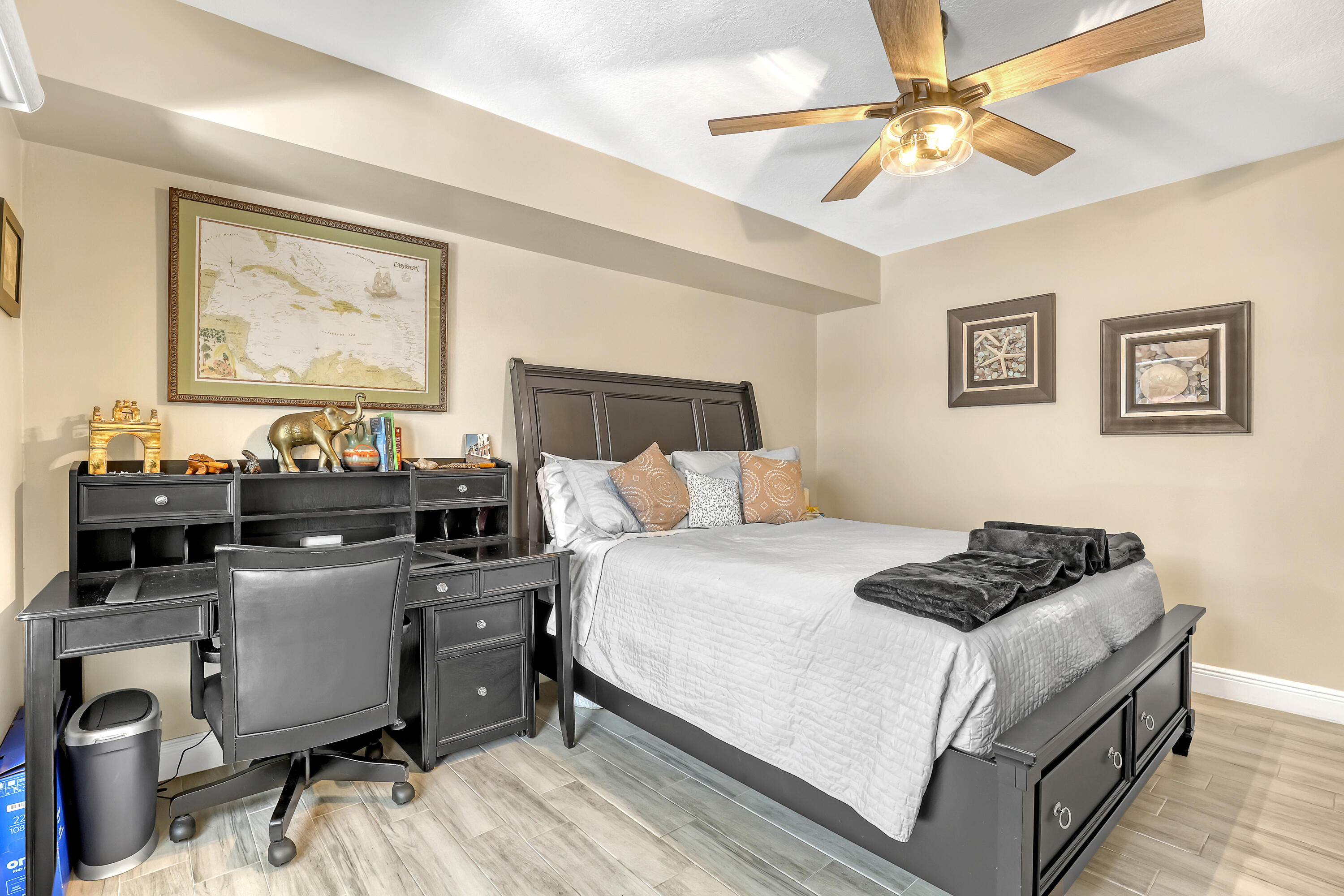 923 Springdale Circle Palm Springs, FL 33461 - Photo 21 of 26 a bedroom with a bed and a chandelier