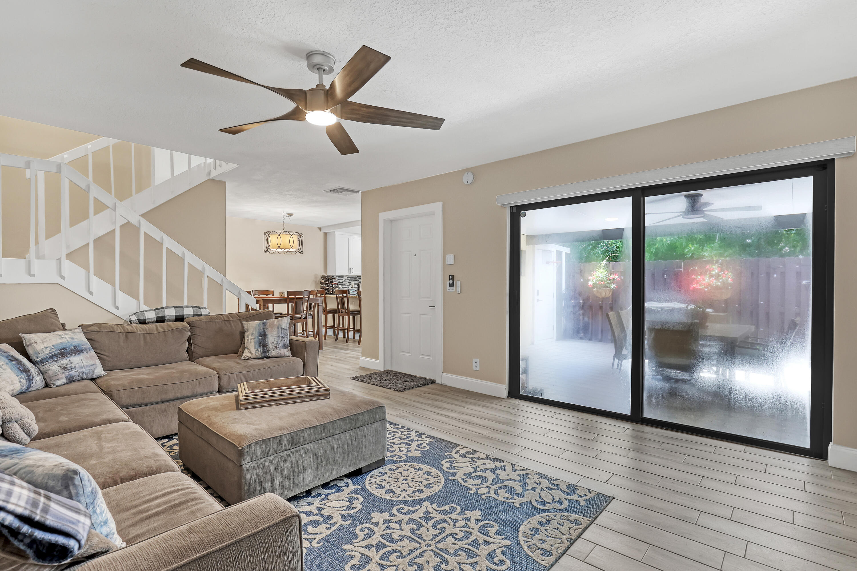 923 Springdale Circle Palm Springs, FL 33461 - Photo 10 of 26 a living room with furniture and a glass door