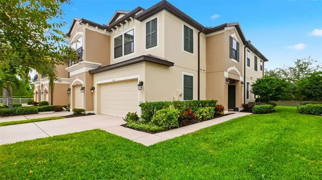 a view of a tables and chairs and tables in the patio