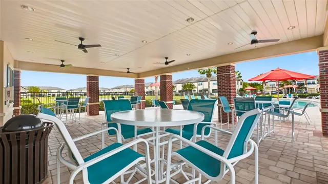 a view of swimming pool with outdoor seating