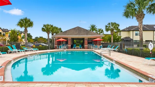 a view of swimming pool from a balcony
