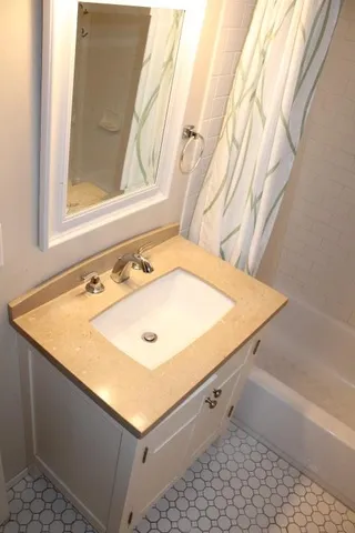 a bathroom with a sink and a bathtub