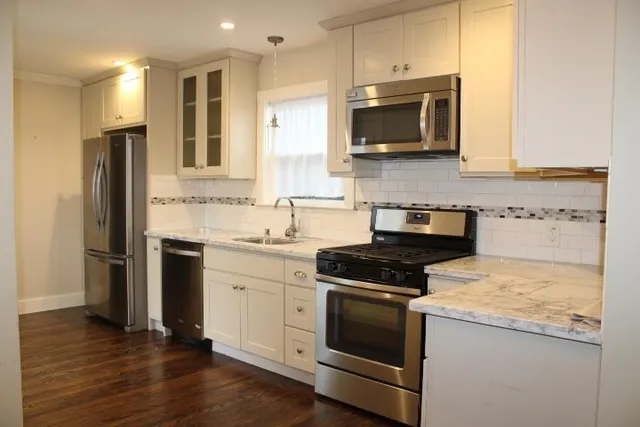 a kitchen with a stove and a microwave