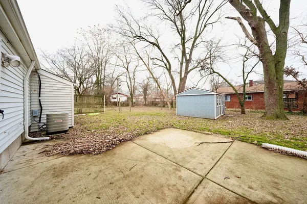 a view of a yard with the trees