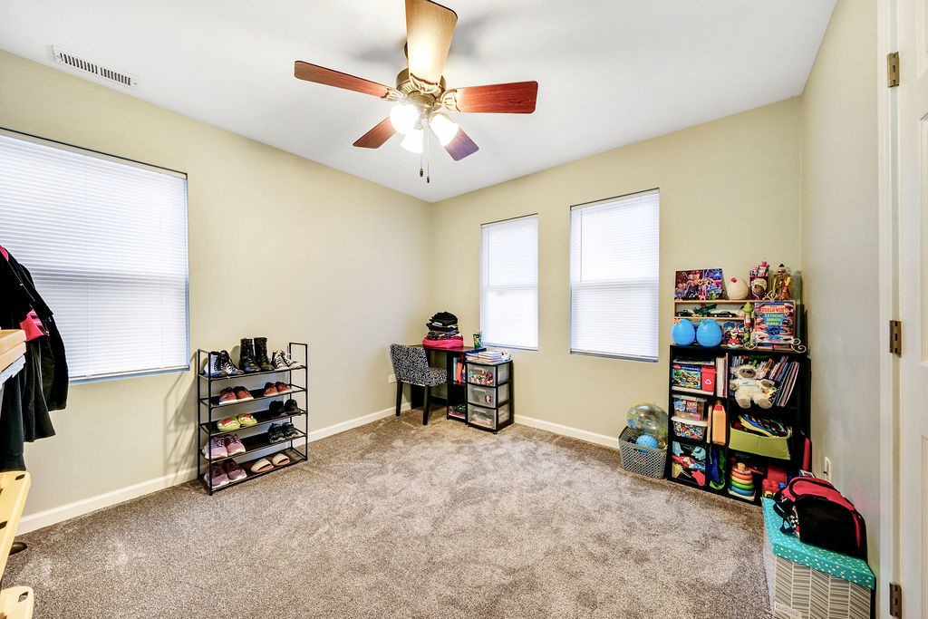 3315 West 161st Street Markham, IL 60428 - Photo 8 of 26 a kids room with toys and dresser