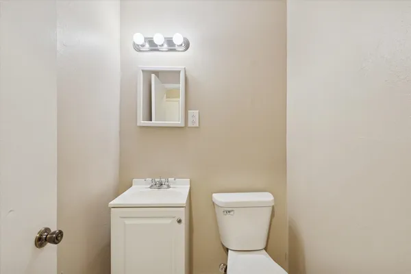 a bathroom with a toilet and a sink