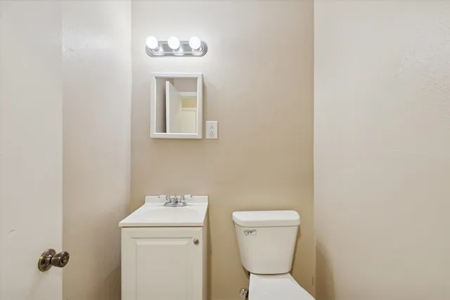 a bathroom with a toilet and a sink