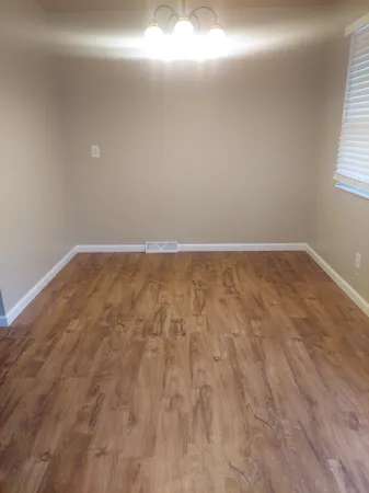 a view of an empty room and window