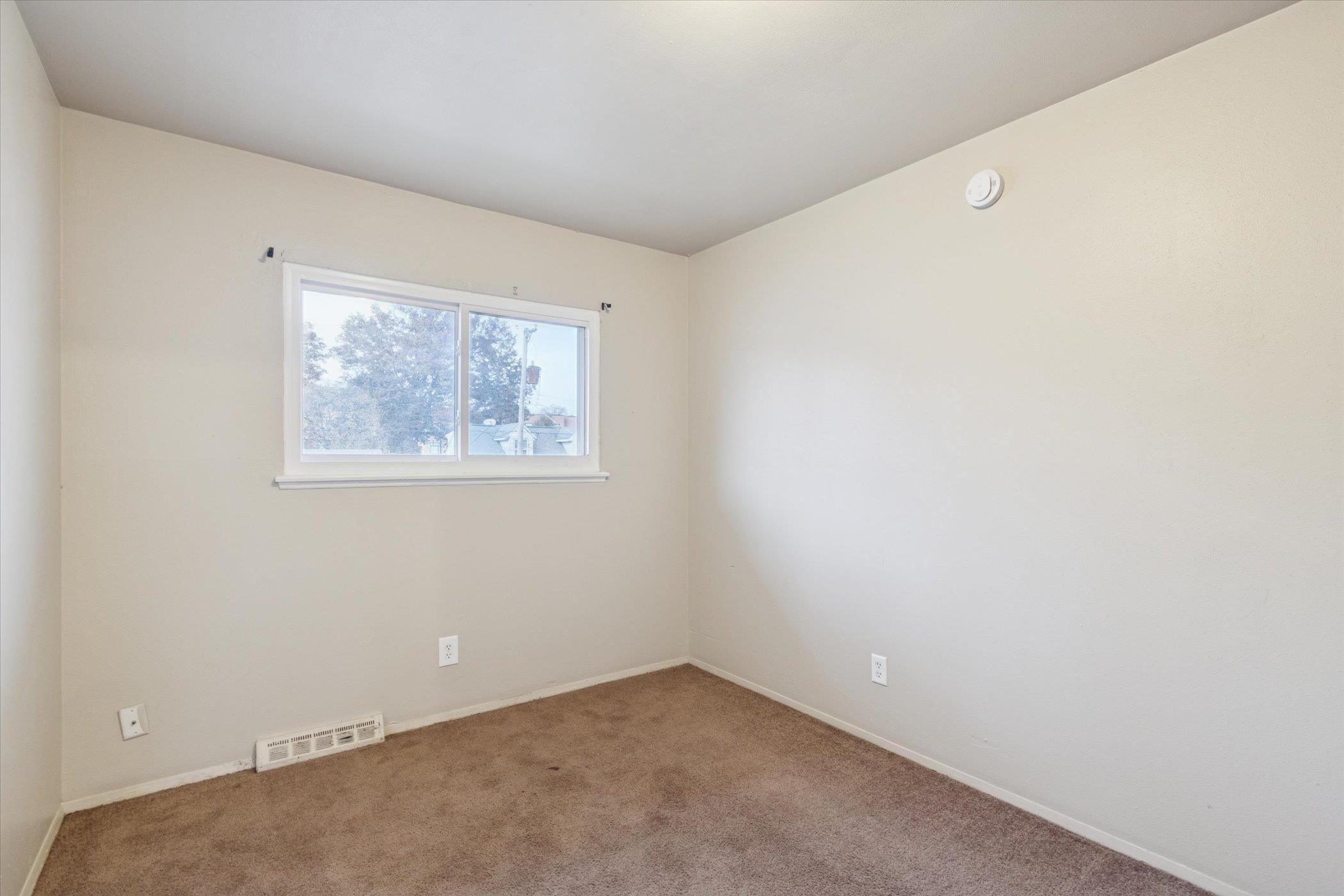 1120 Lincoln Avenue Rockford, IL 61102 - Photo 8 of 12 an empty room with windows