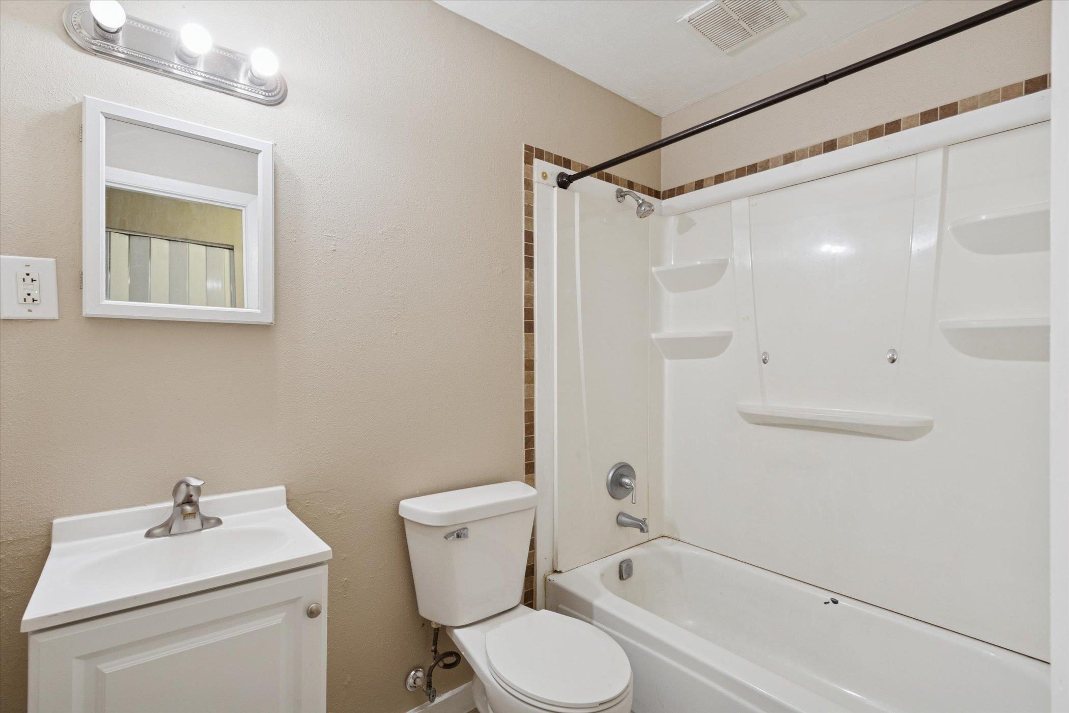 1120 Lincoln Avenue Rockford, IL 61102 - Photo 10 of 12 a bathroom with a sink toilet and shower