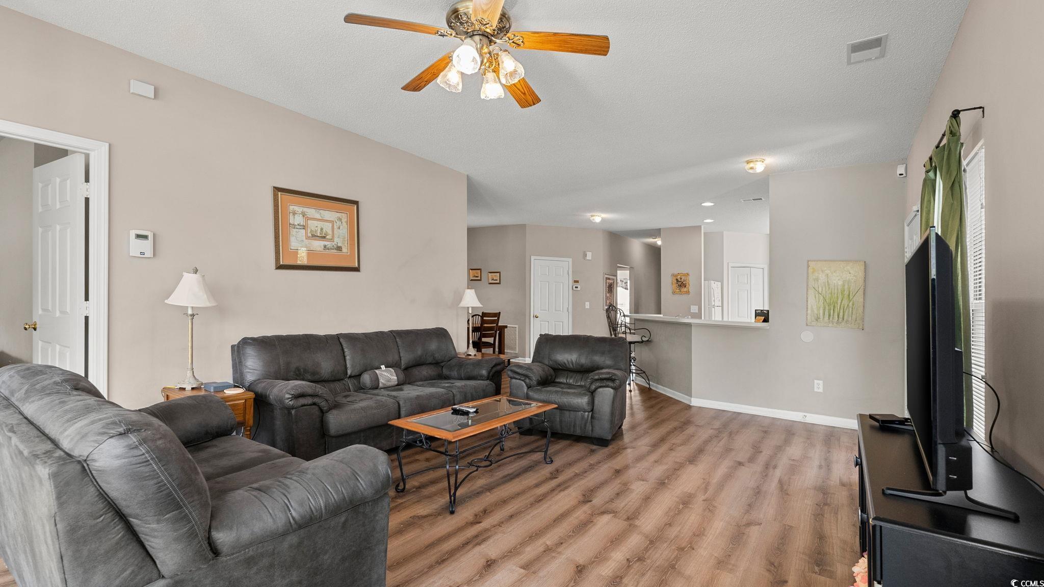 4431 Montrose Lane, Unit A Myrtle Beach, SC 29579 - Photo 16 of 32 Living room featuring ceiling fan and light wood-type flooring
