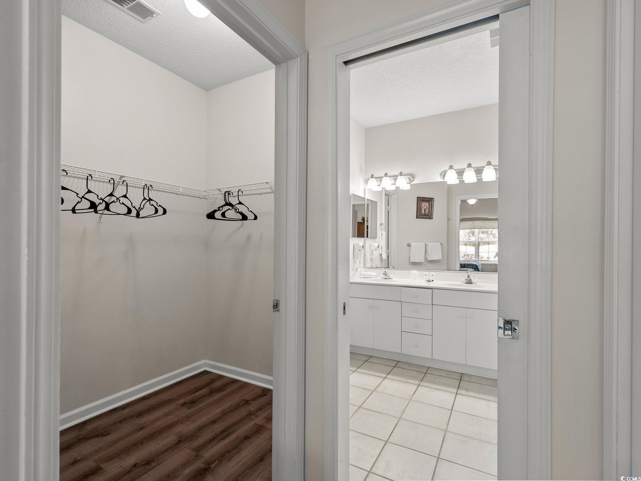 4431 Montrose Lane, Unit A Myrtle Beach, SC 29579 - Photo 17 of 32 Walk in closet with light wood finished floors