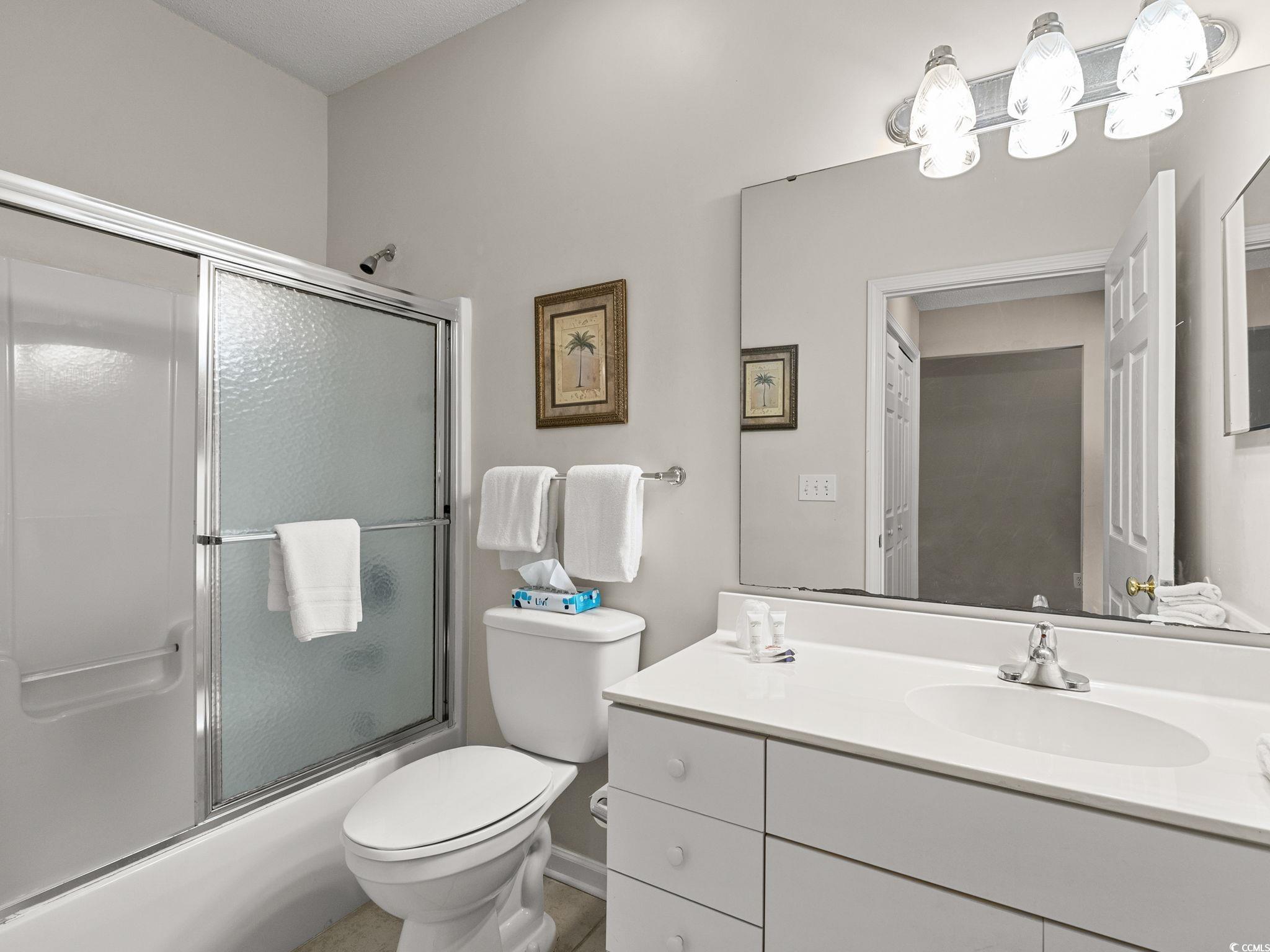 4431 Montrose Lane, Unit A Myrtle Beach, SC 29579 - Photo 23 of 32 Full bathroom featuring vanity and shower / bath combination with glass door