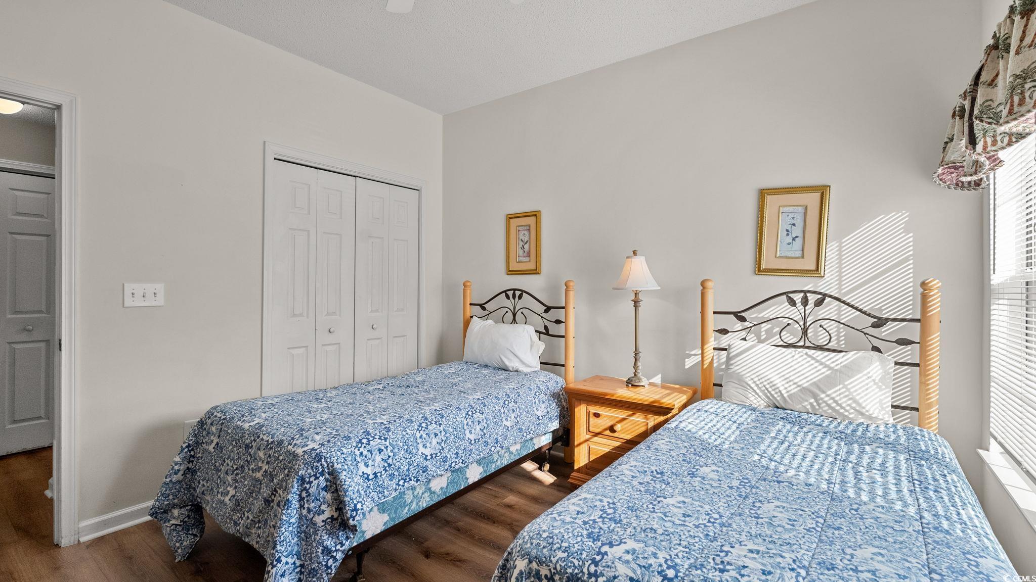 4431 Montrose Lane, Unit A Myrtle Beach, SC 29579 - Photo 25 of 32 Bedroom with wood finished floors, a closet, and a ceiling fan