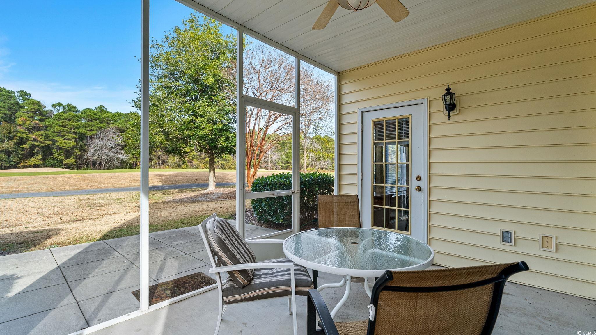 4431 Montrose Lane, Unit A Myrtle Beach, SC 29579 - Photo 4 of 32 Sunroom / solarium with ceiling fan and outdoor dining area