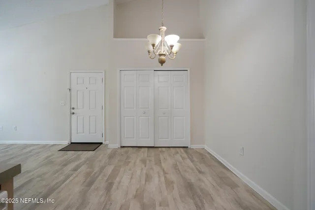 an empty room with wooden floor