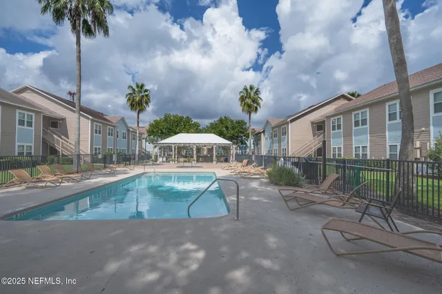 a view of a swimming pool with a patio