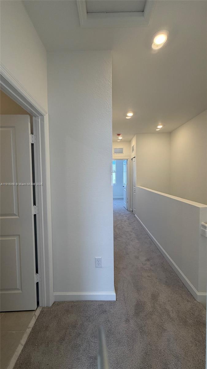 15592 Southwest 276th Terrace Homestead, FL 33031 - Photo 7 of 12 a view of hallway with a hallway