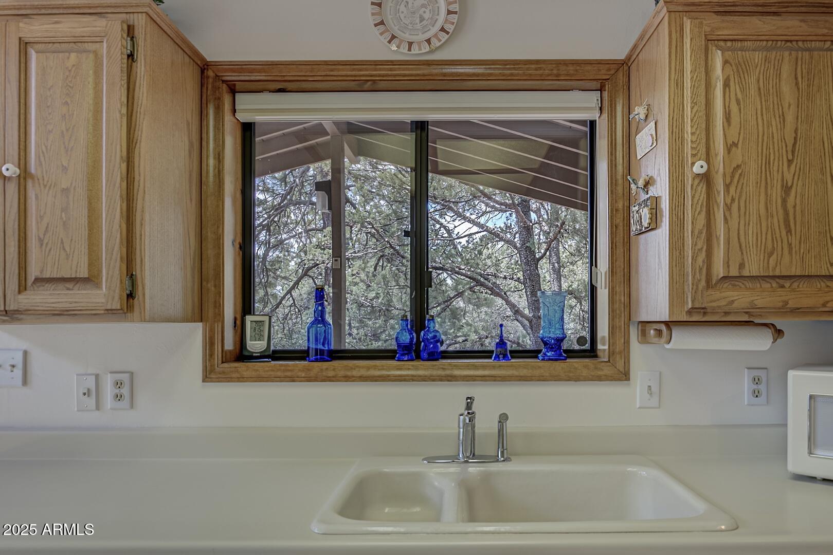 5838 Arroyo Way Pine, AZ 85544 - Photo 11 of 53 a bathroom with mirror and window