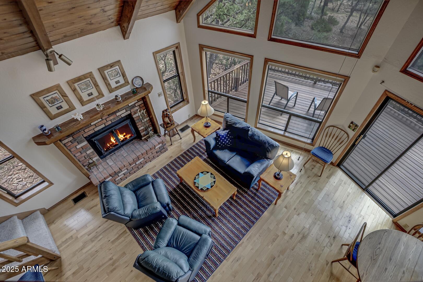 5838 Arroyo Way Pine, AZ 85544 - Photo 18 of 53 a living room with furniture and a rug