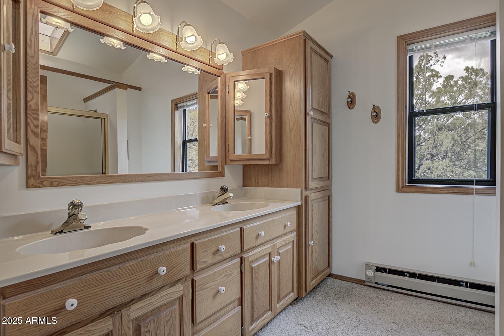 5838 Arroyo Way Pine, AZ 85544 - Photo 23 of 53 a bathroom with a granite countertop sink mirror and double