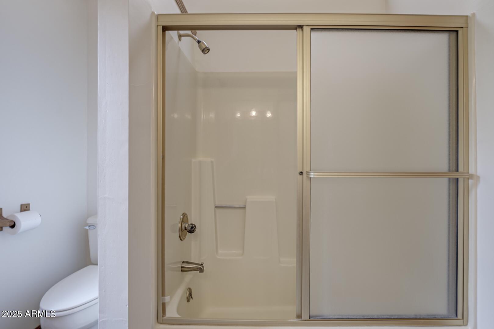 5838 Arroyo Way Pine, AZ 85544 - Photo 24 of 53 a bathroom that has a glass shower door