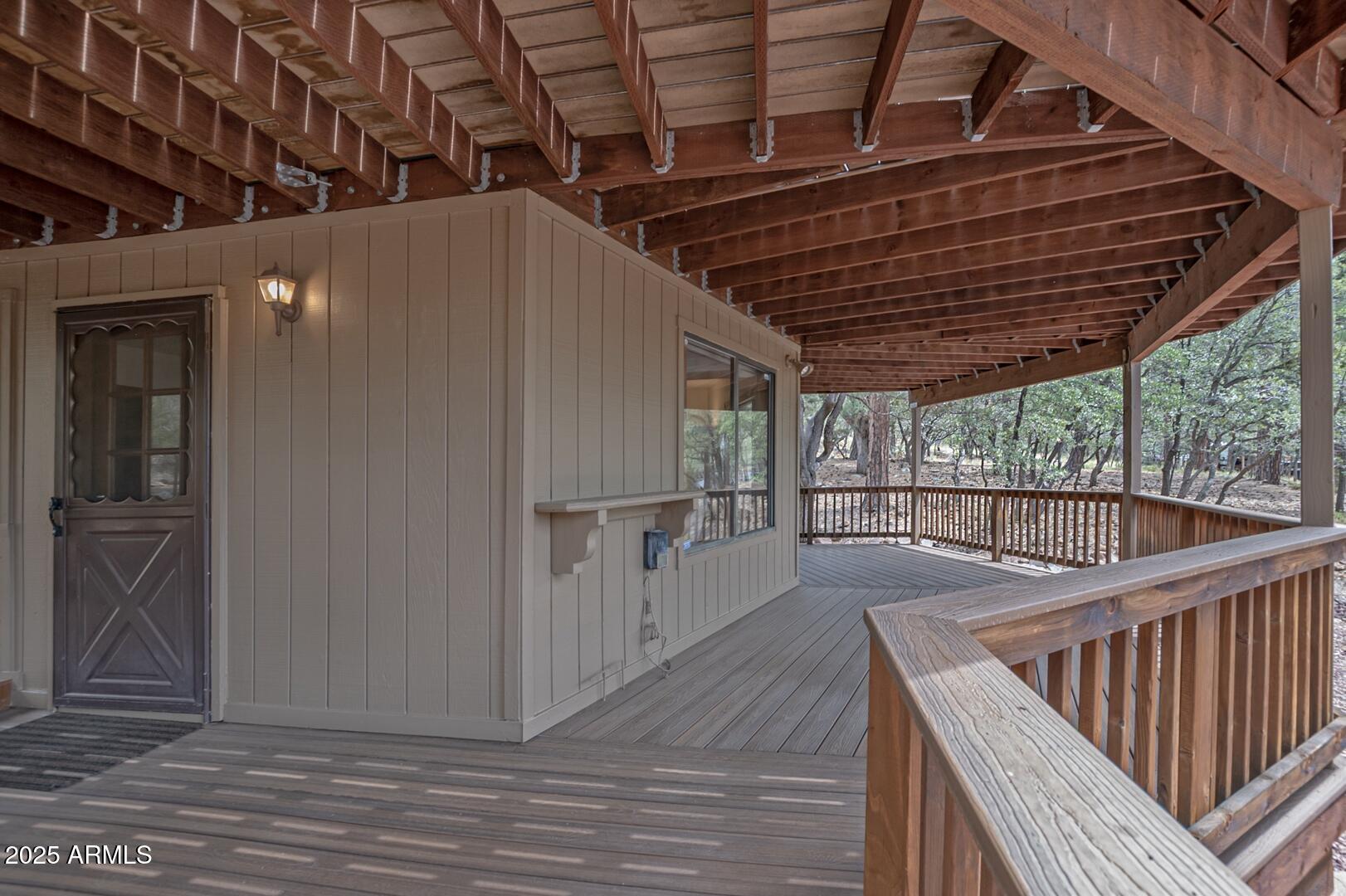 5838 Arroyo Way Pine, AZ 85544 - Photo 40 of 53 a view of a balcony with wooden floor