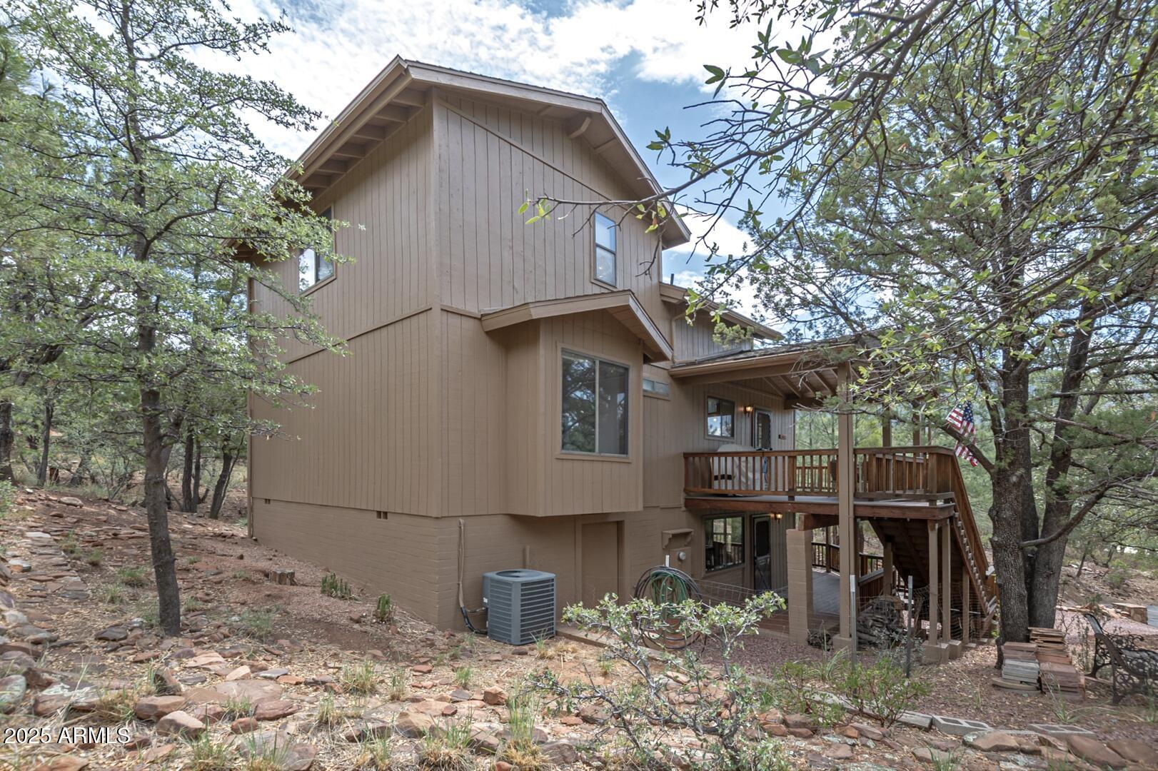 5838 Arroyo Way Pine, AZ 85544 - Photo 42 of 53 a view of a house with a yard