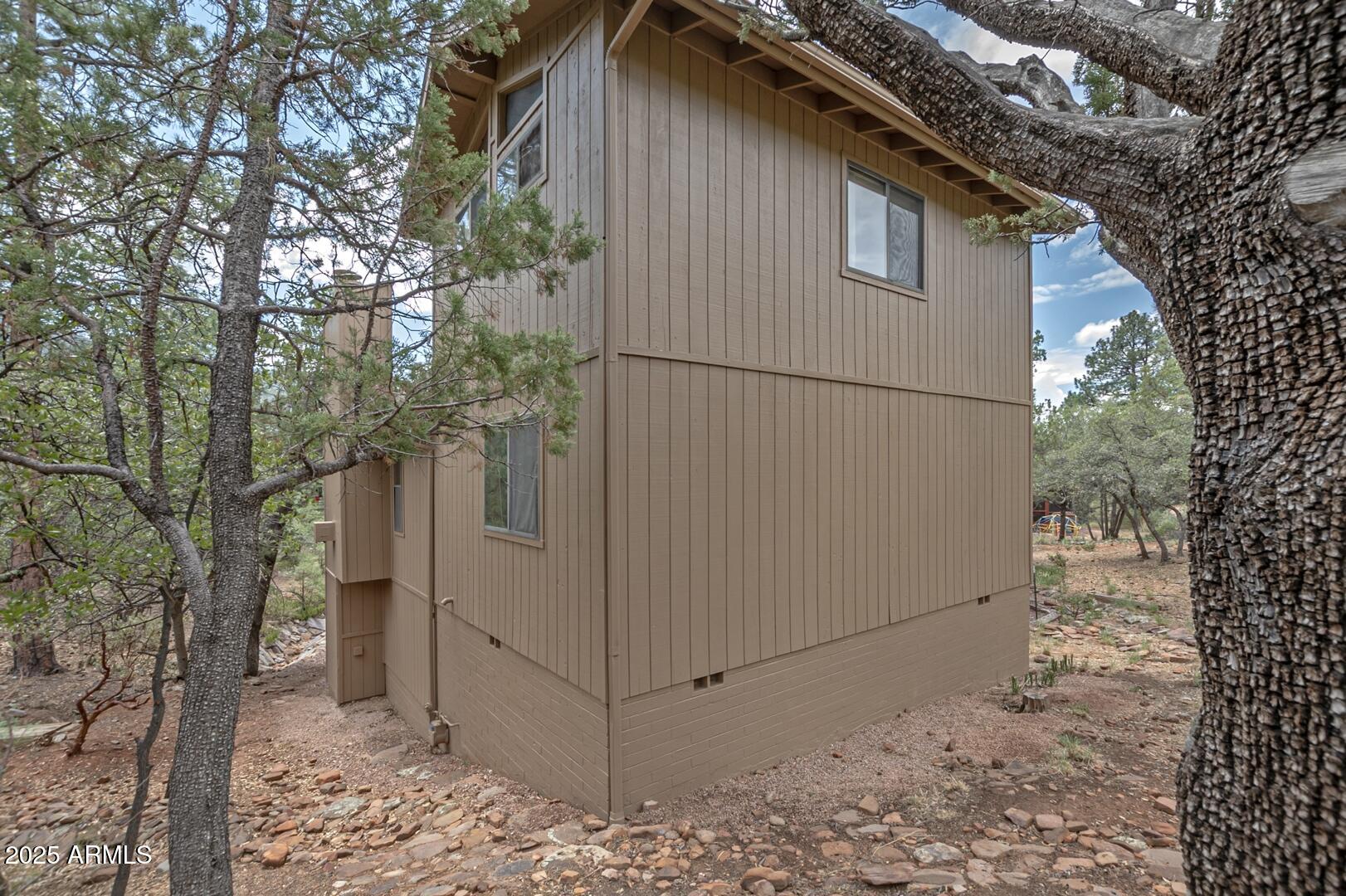 5838 Arroyo Way Pine, AZ 85544 - Photo 44 of 53 a view of a house with a tree