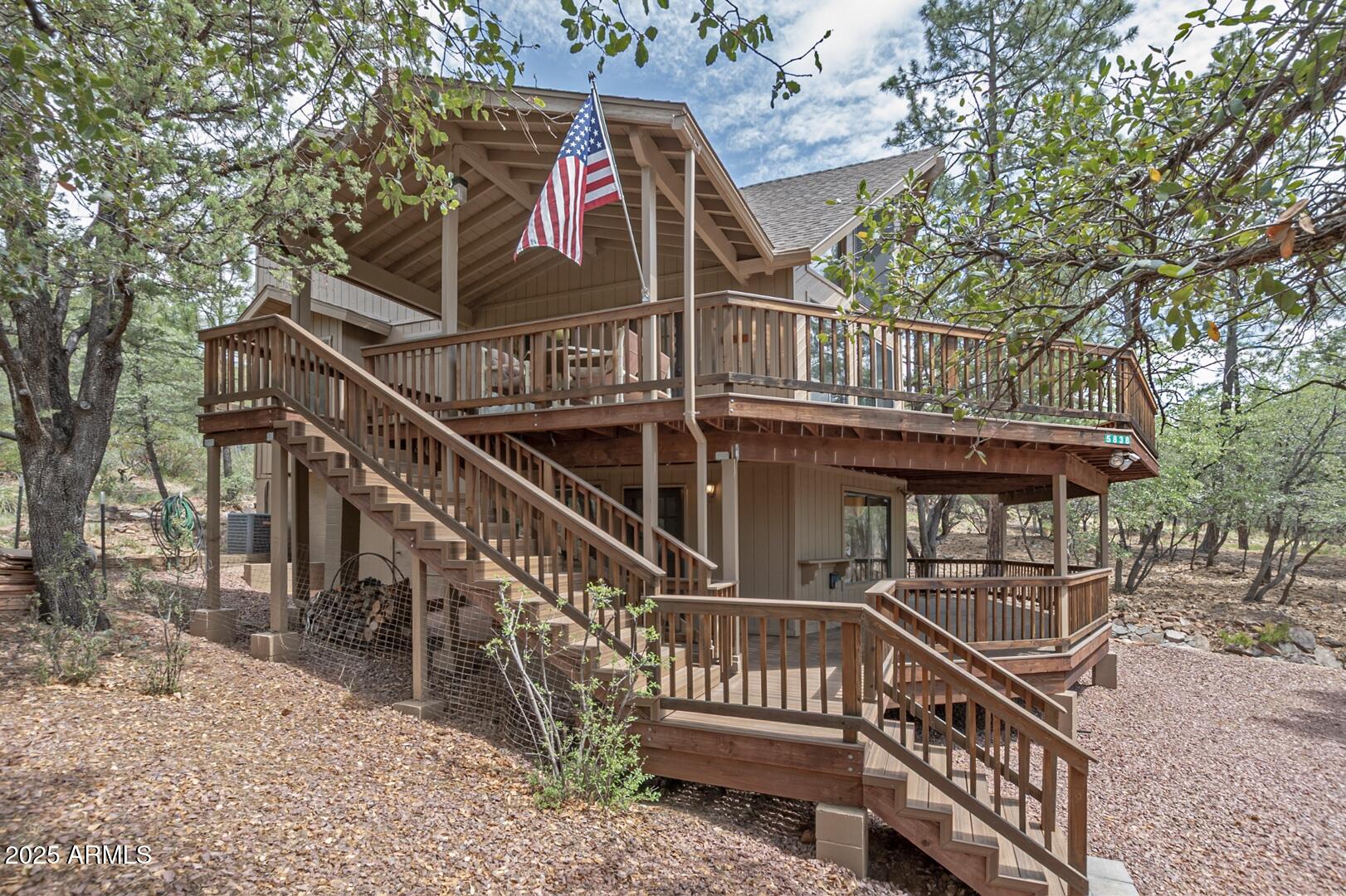 5838 Arroyo Way Pine, AZ 85544 - Photo 46 of 53 a view of a roof deck with table and chairs