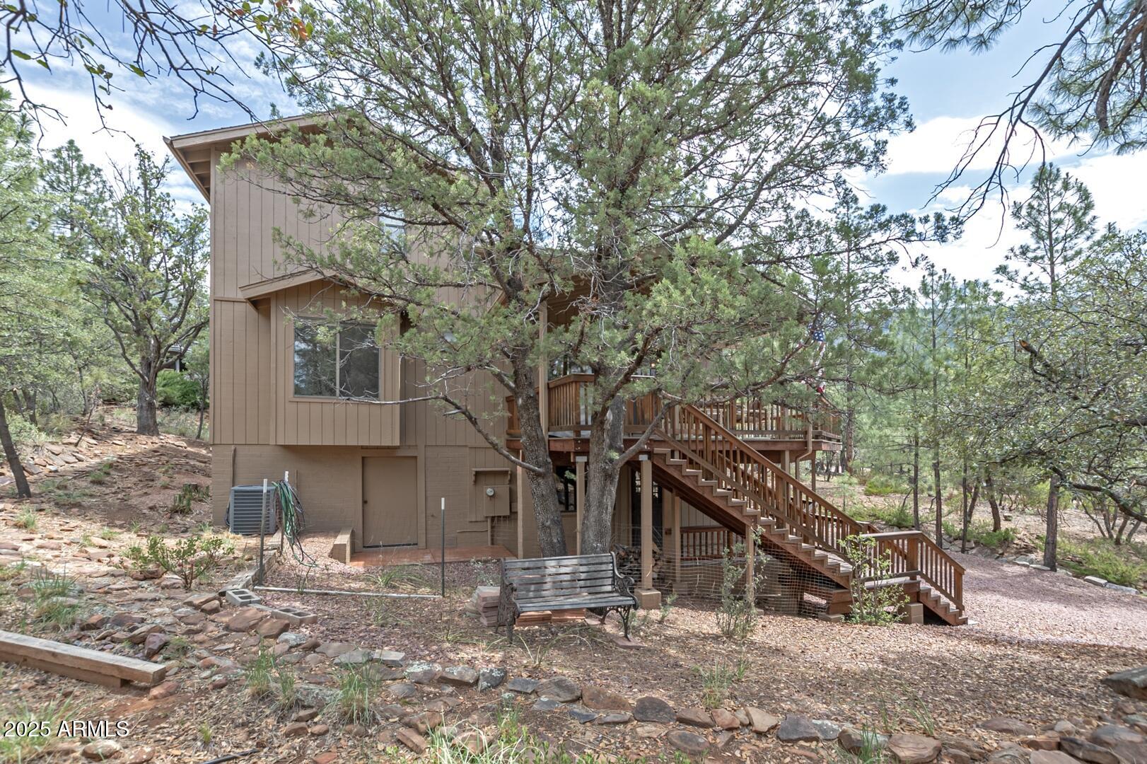 5838 Arroyo Way Pine, AZ 85544 - Photo 48 of 53 a view of a house with a yard
