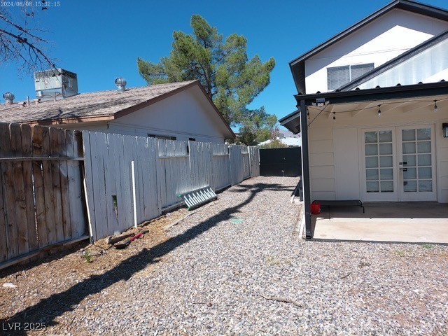 809 Peacock Court Las Vegas, NV 89145 - Photo 15 of 15 View of home's exterior with a patio and french doors