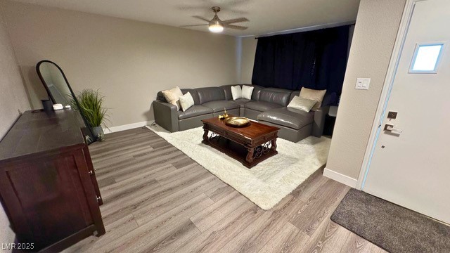 809 Peacock Court Las Vegas, NV 89145 - Photo 4 of 15 Living room featuring luxury vinyl plank floors and a ceiling fan