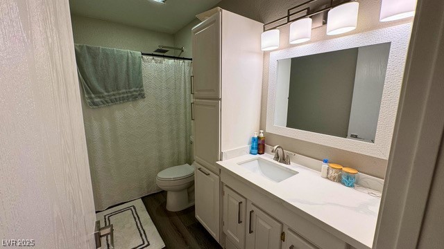 809 Peacock Court Las Vegas, NV 89145 - Photo 9 of 15 Bathroom featuring vanity, a shower with shower curtain, luxury vinyl plank floors, and a textured wall