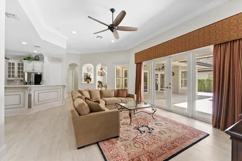 a kitchen with white cabinets and sink